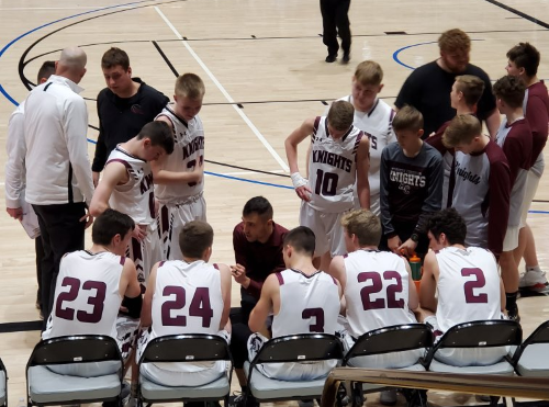 Aberdeen Christian boys basketball team during a game time out